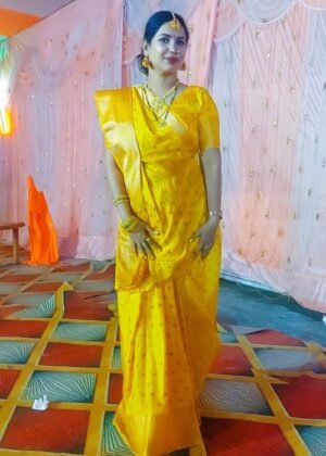 Women's yellow Banarasi soft silk saree with intricate weaving and a matching blouse piece.