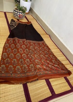 Handcrafted Ajrakh saree with floral motifs and contrasting black pallu