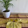 Handcrafted silk blouse in yellow with delicate patterns