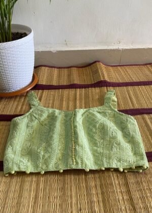 Green Sleeveless Designer Blouse with Threadwork Patterns and Front Button Design