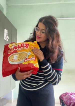 Saffola Oodles Yummy Masala Instant Ring Noodles pack of 14, showcasing millet & oats-based ring noodles and masala seasoning.