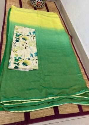 Green and yellow ombre saree paired with a floral blouse, displayed on a woven mat.