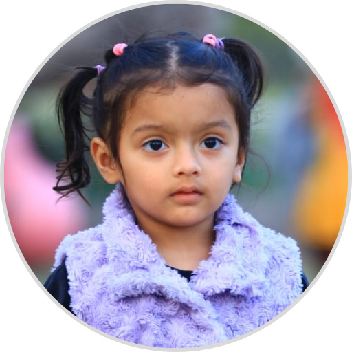 Aamaya Naithani, an adorable and lively young girl, radiating joy and curiosity with her bright smile and playful energy.