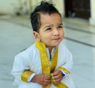 Ruman Siddiqui, a cheerful and curious young boy, radiating energy and creativity while embracing the excitement of learning and exploration.