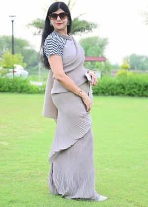 Elegant women's Chinon full crushed pleated saree in grey with unstitched blouse piece.