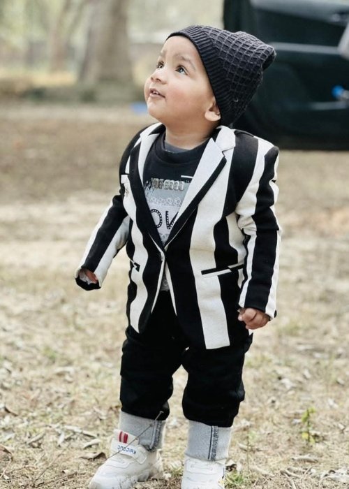 Ruman Siddiqui, a cheerful and curious young boy, radiating energy and creativity while embracing the excitement of learning and exploration.