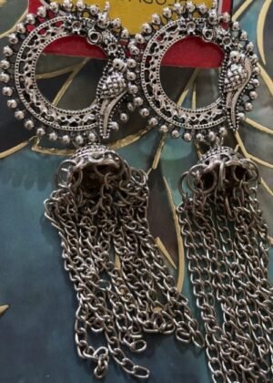 Handmade silver earrings with intricate circular design, bird motifs, and chain tassels.