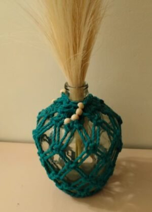 Handmade vase with teal macramé wrapping and natural bead accents, ideal for home decor. Keyword Density