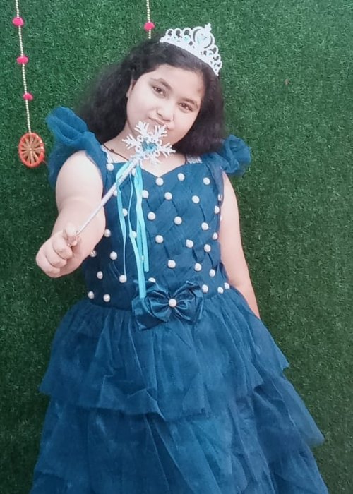 Jivika Gorke, a joyful and curious young girl, embracing childhood with a bright smile and playful spirit.