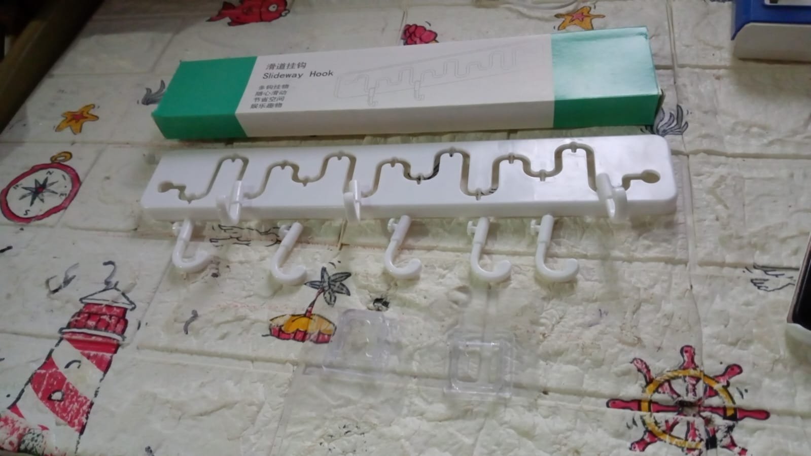 Adjustable Wall Hook: Slides for Easy Access (Bathroom & Home) - Shivani Jaswal Adjustable Wall Hook: Slides for Easy Access (Bathroom & Home)